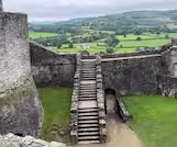 Image of a castle walkway and green space