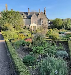 Image of a house and grounds with green space